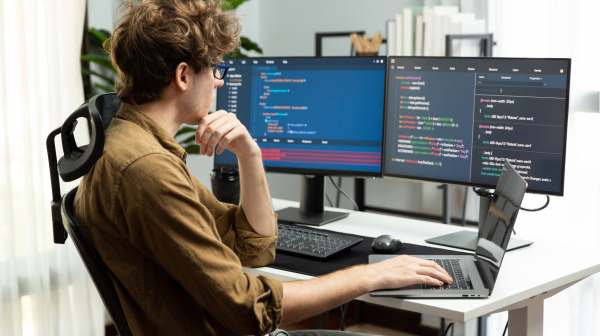 IT developer with stressful overworked in creating online software code. Gusher.